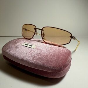 Miu Miu Oval Gold Women’s Sunglasses MU A50S